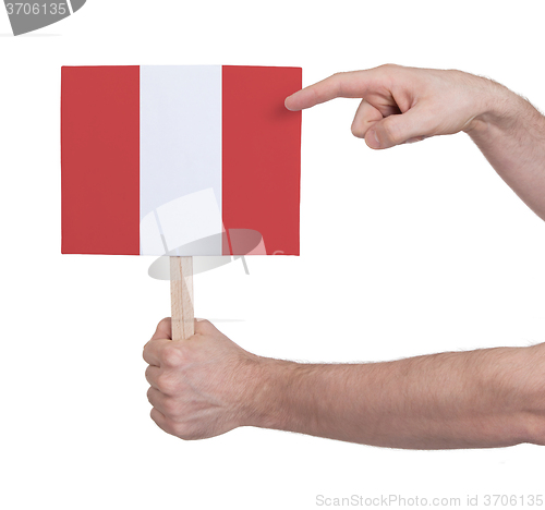 Image of Hand holding small card - Flag of Peru