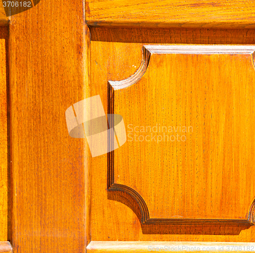 Image of texture of a brown old door in italy europe