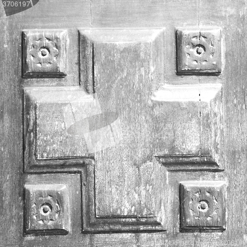 Image of texture of a brown old door in italy europe