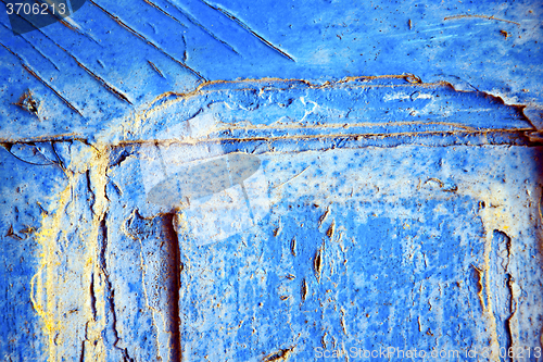 Image of dirty stripped paint in  blue gold