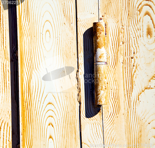 Image of   metal brown  rusty      morocco in africa the old wood  facade