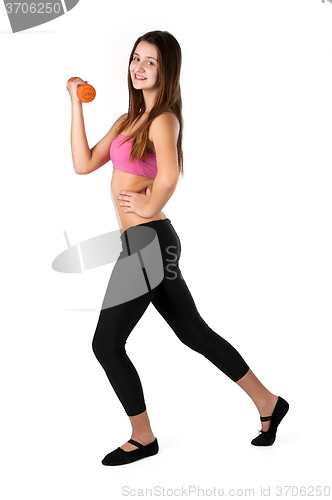 Image of Young smiling fitness woman working out