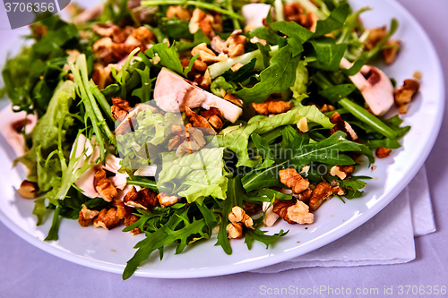 Image of salad with pear, walnuts