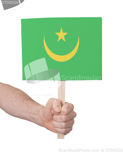 Image of Hand holding small card - Flag of Mauritania