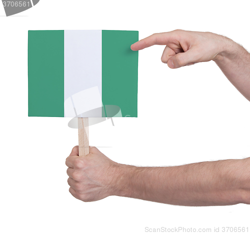 Image of Hand holding small card - Flag of Nigeria