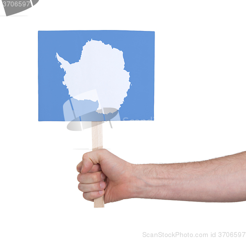 Image of Hand holding small card - Flag of Antarctica