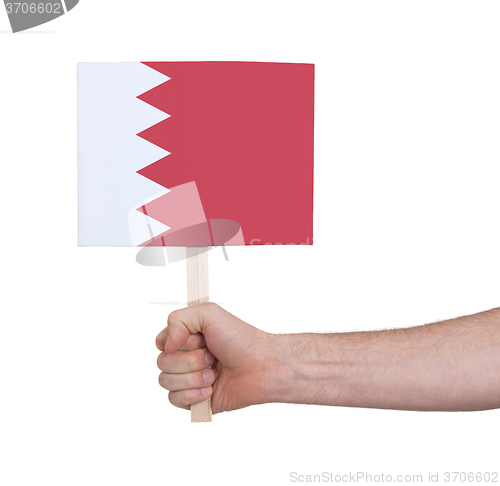 Image of Hand holding small card - Flag of Bahrain