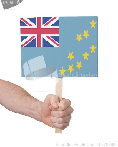 Image of Hand holding small card - Flag of Tuvalu