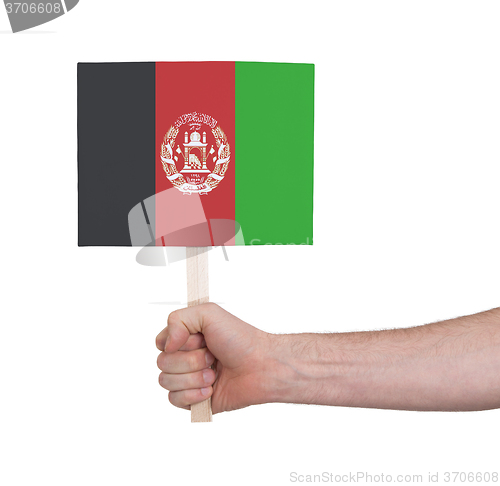 Image of Hand holding small card - Flag of Afghanistan