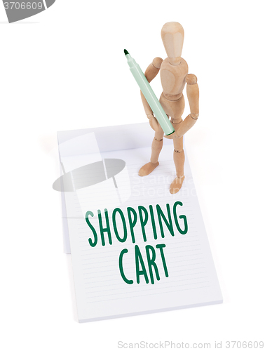 Image of Wooden mannequin writing - Shopping cart