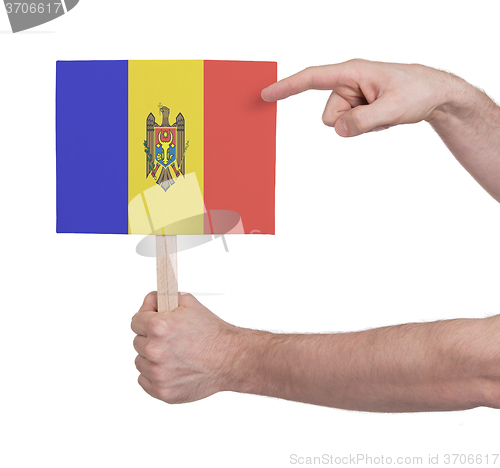 Image of Hand holding small card - Flag of Moldova