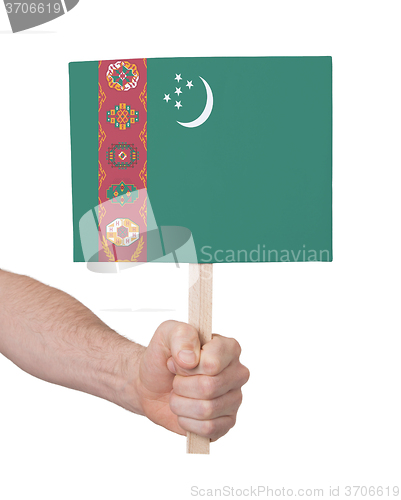 Image of Hand holding small card - Flag of Turkmenistan