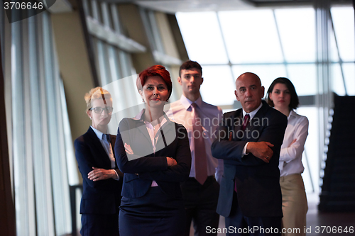 Image of diverse business people group with redhair  woman in front