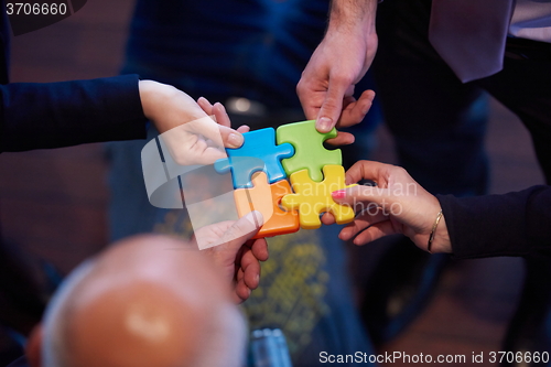 Image of assembling jigsaw puzzle