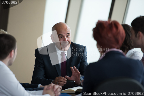 Image of business people group on meeting at modern bright office