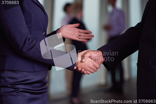 Image of handshake of business woman and man