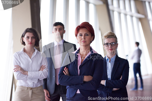 Image of diverse business people group with redhair  woman in front