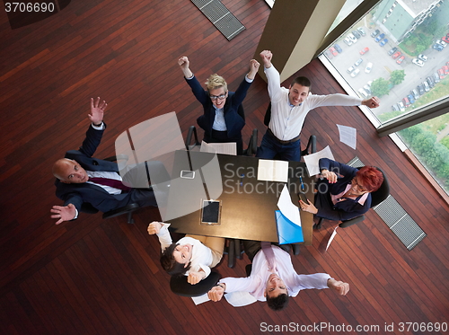 Image of top view of business people group throwing dociments in air