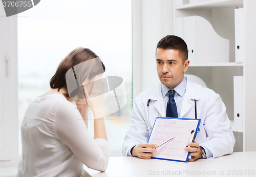 Image of doctor and young woman meeting at hospital