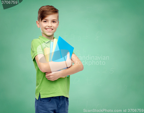 Image of happy student boy with folders and notebooks