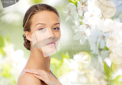 Image of smiling young woman face and shoulders