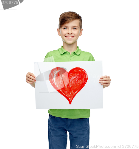 Image of happy boy holding drawing or picture of red heart