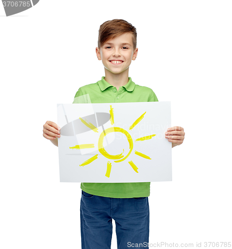 Image of happy boy holding drawing or picture of sun