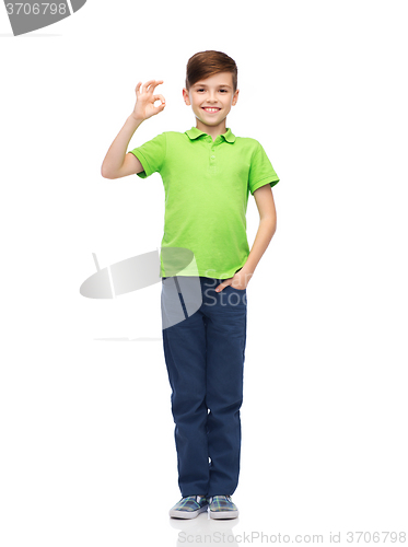 Image of happy boy in white t-shirt showing ok hand sign