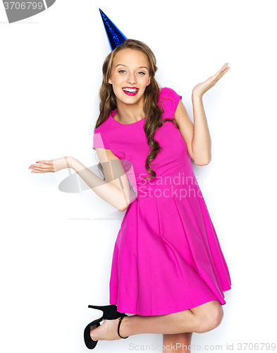 Image of happy young woman or teen girl in party cap