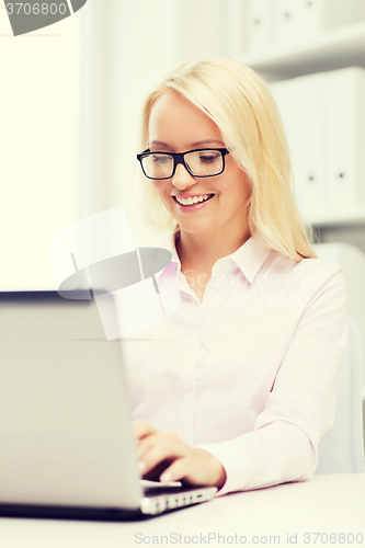 Image of smiling businesswoman or student with laptop