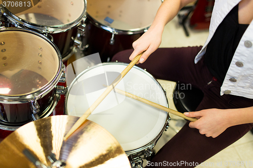 Image of close up of musician playing cymbals on drum kit