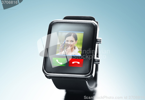 Image of close up of black smart watch with video call icon