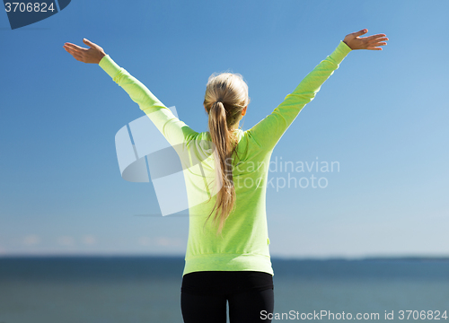 Image of woman doing sports outdoors