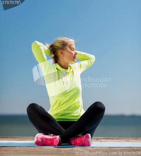 Image of woman doing yoga outdoors