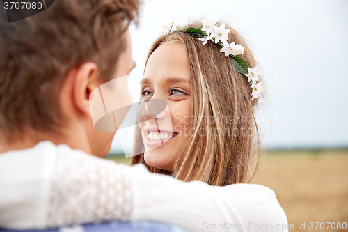 Image of happy smiling young hippie couple outdoors