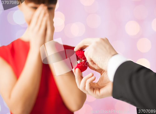 Image of close up of couple with diamond engagement ring