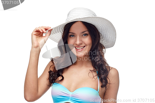 Image of happy young woman in bikini swimsuit and sun hat