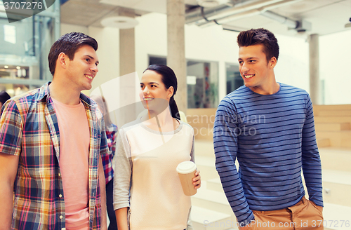 Image of group of smiling students with paper coffee cups