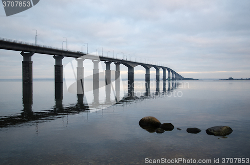 Image of The bridge is reflecting in the calm water