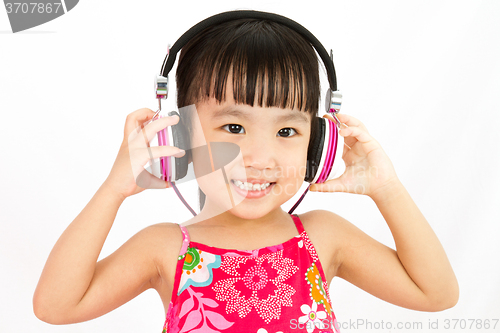 Image of Chinese little girl on headphones