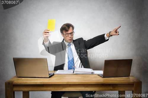 Image of Business man with yellow card