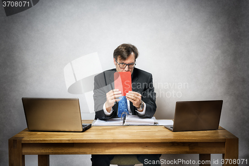 Image of business man with red card