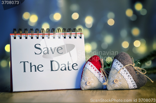 Image of ring binder with text Save The Date