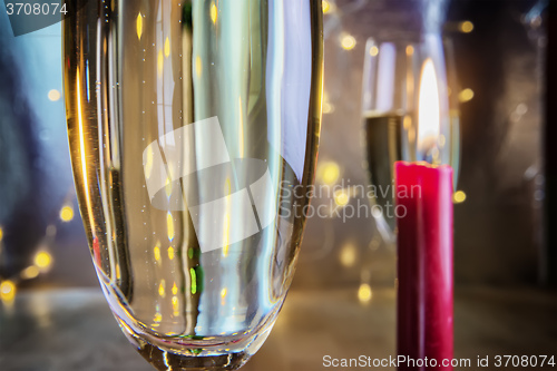 Image of Champagne glasses with candle