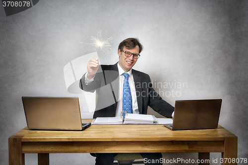 Image of business man with sparkler