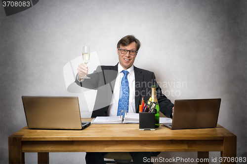 Image of Business man with champagne glass
