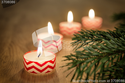 Image of Romantic candles on wooden table