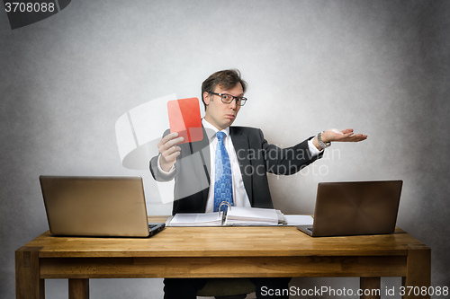 Image of business man with red card