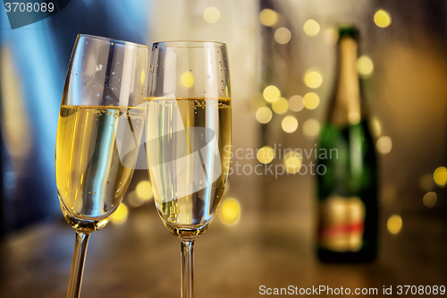 Image of Champagne glasses with bottle