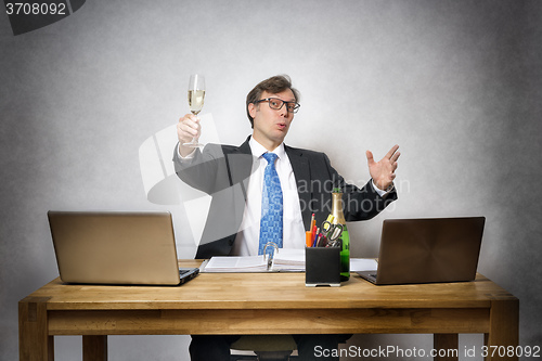 Image of Business man with champagne glass